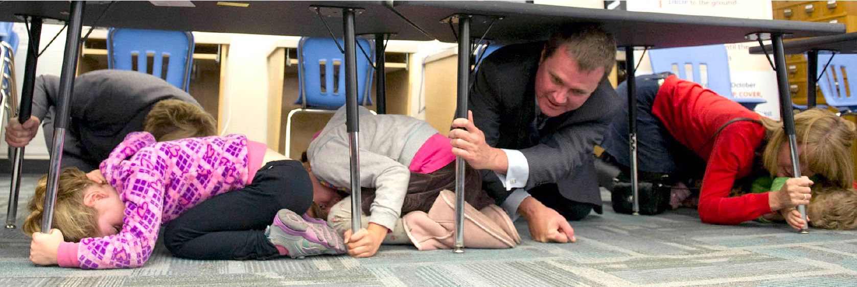Drop, Cover, Hold On in a school
